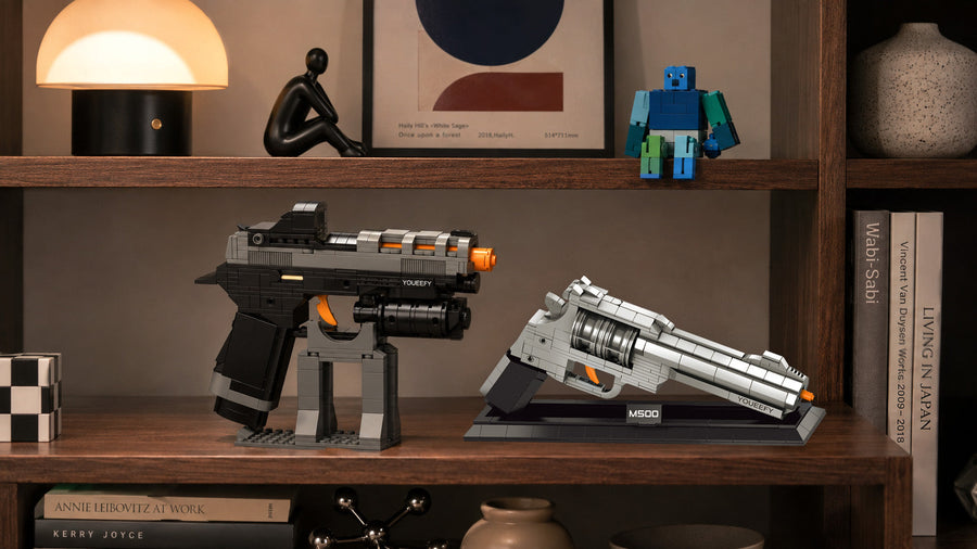 YOUEEFY brick-built pistol and M500 revolver static display models on a wooden bookshelf with books and home decor